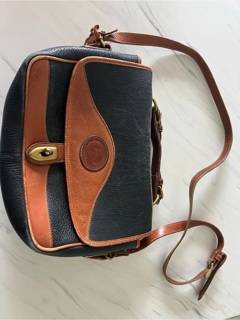 Dooney & Bourke Black and Brown Leather Satchel with Brass Turn Lock